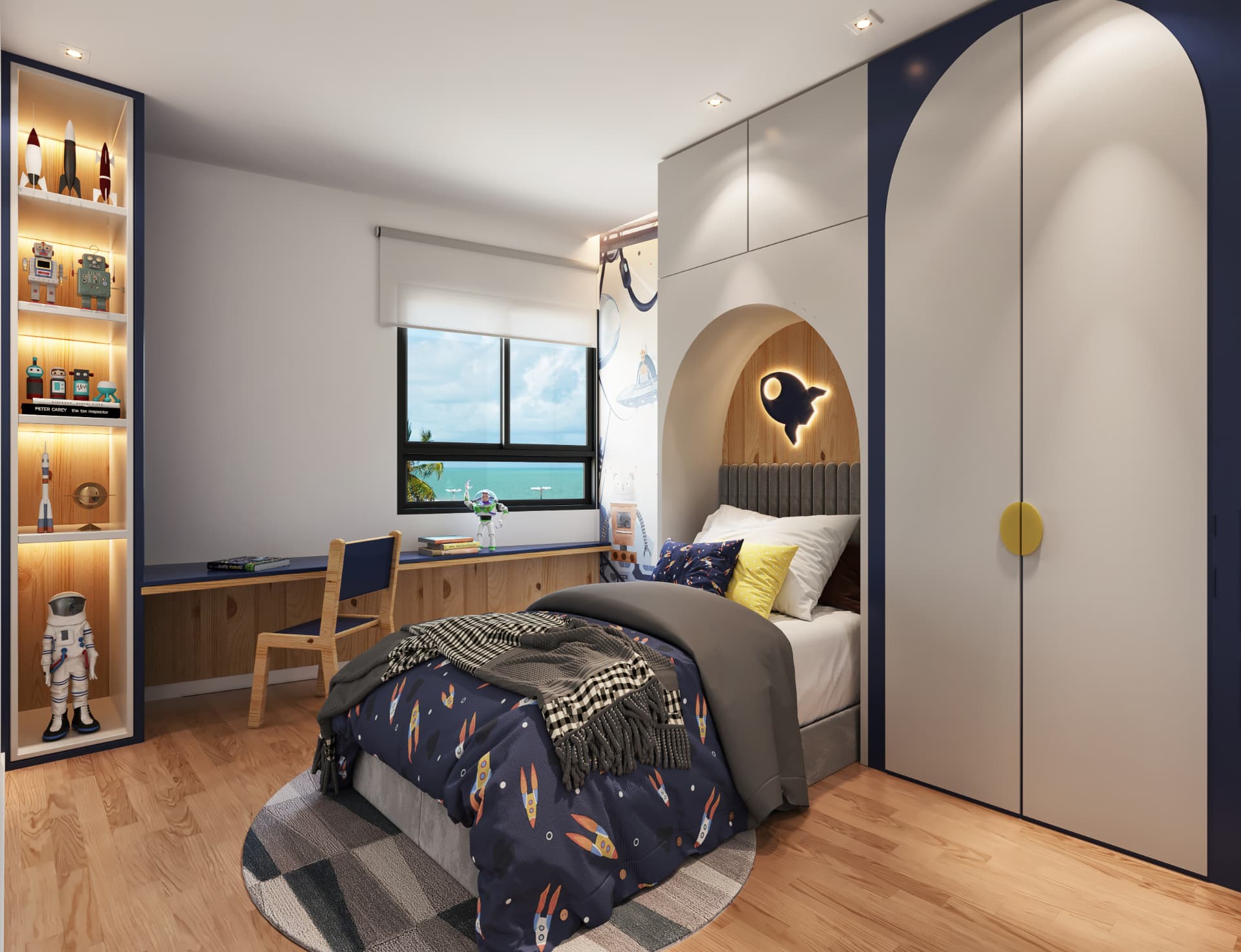 Dormitório com cama, armário com portas claras, escrivaninha e janela com vista para o mar