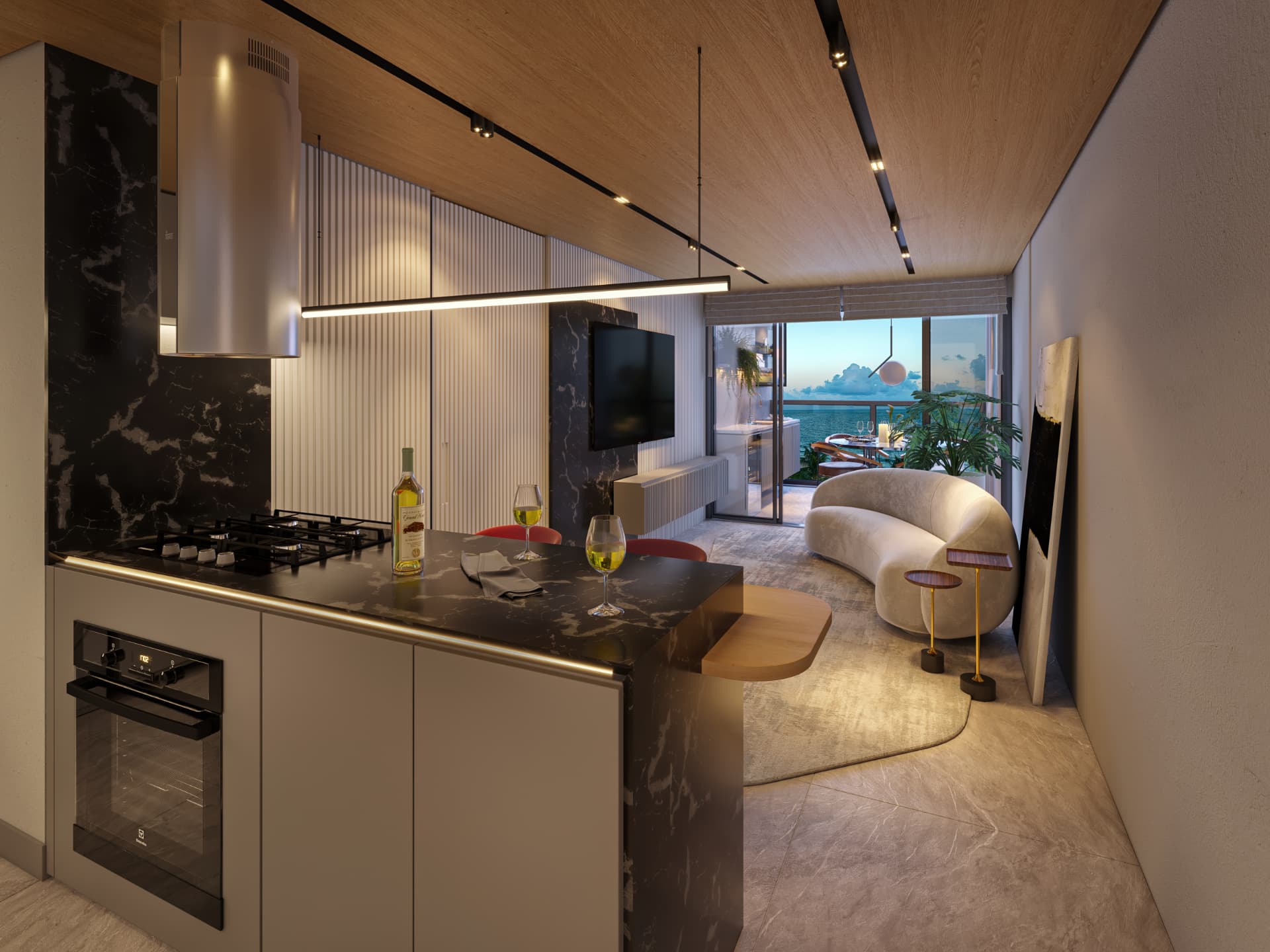 Sala e cozinha integradas do apartamento de 3 quartos, com ilha, painel de TV e varanda com vista para o mar